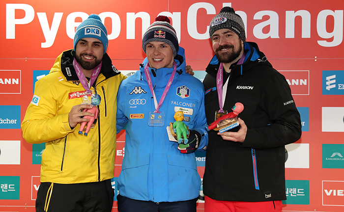 Dominik Fischnaller (center) from Italy, Andi Langenhan from Germany (left) and Samuel Edney, the top three men’s single lugers in the Viessman Luge World Cup, put on bright smiles during the awards ceremony.